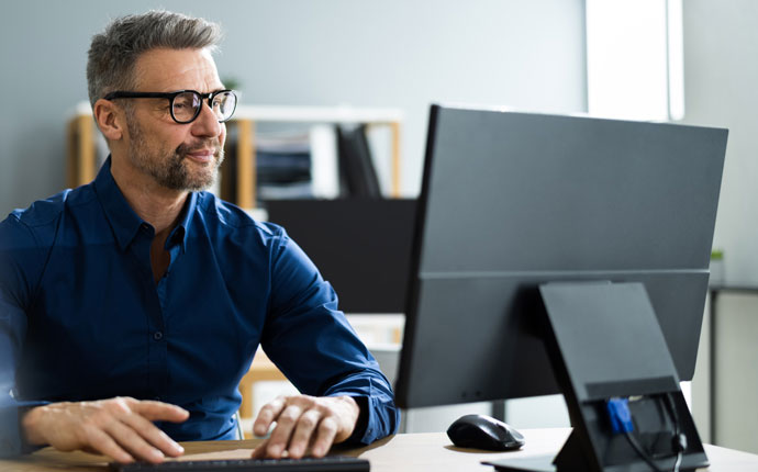 A business person working at a computer