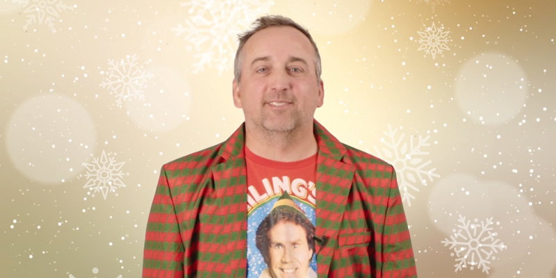 Director of client experience Matt Spethman wearing an ELF tshirt with a red and green jacket
