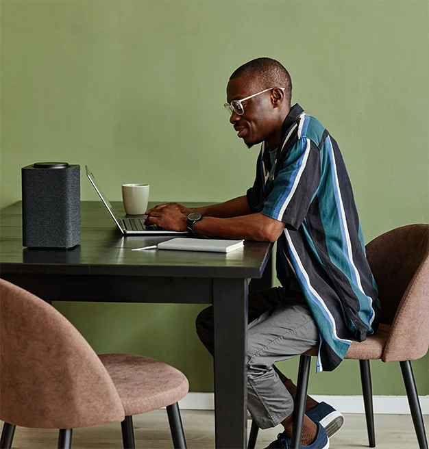 A man working remotely at his desk