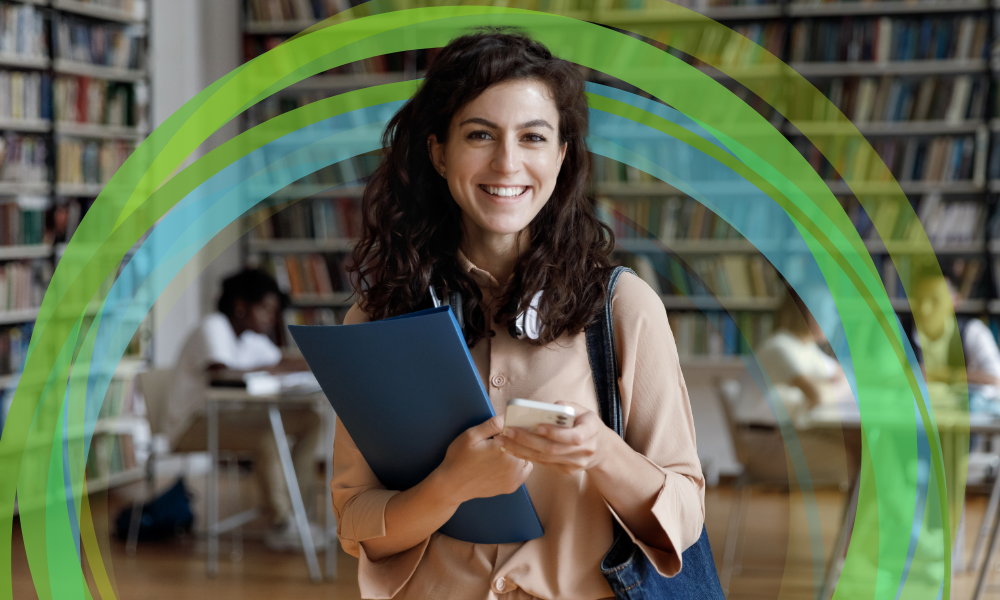 Smiling student in library with green concentric circles in background